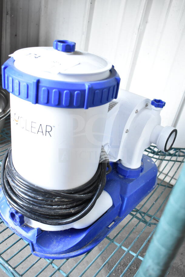 FlowClear 90403E Filter Pump, white with blue accents, coiled power cord, 110-120V, for pool filtration.