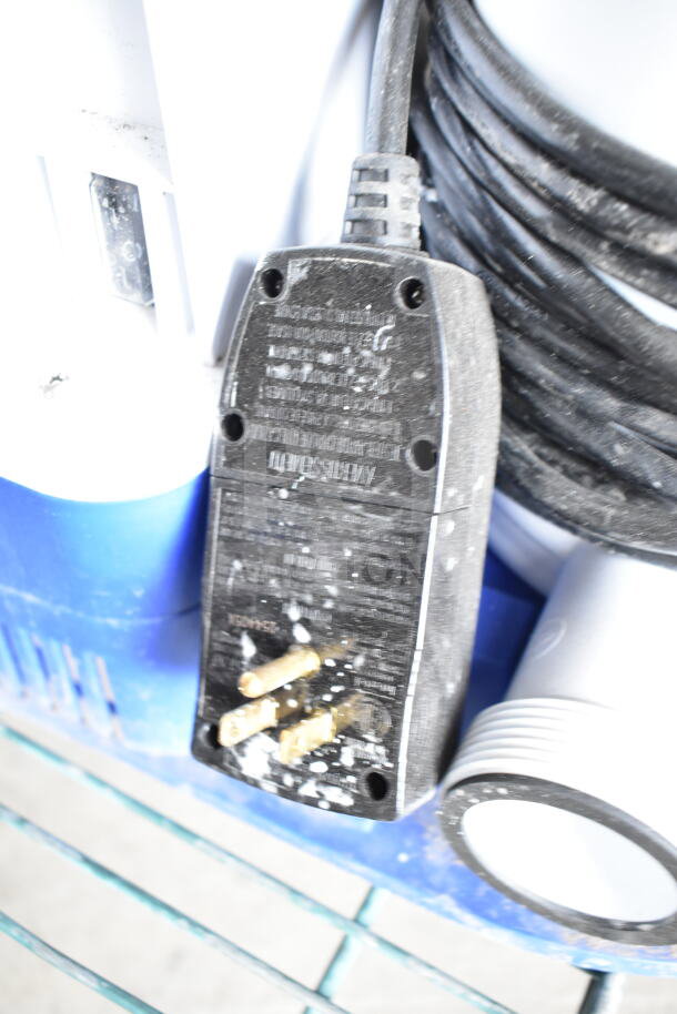 FlowClear 90403E Filter Pump, 110-120V, 1 Phase, black power plug with visible wear, coiled black cord, blue casing.