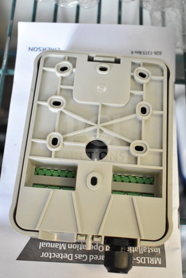 Emerson MRLDS-250 Infrared Gas Detector, new condition, with visible connectors and Emerson branding on manual below.