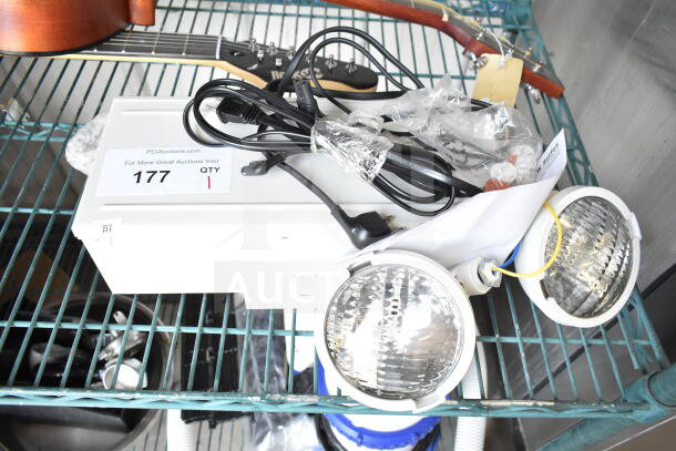 Dual Lite LMW40I-FW emergency light, brand new condition, includes wiring and original packaging visible.