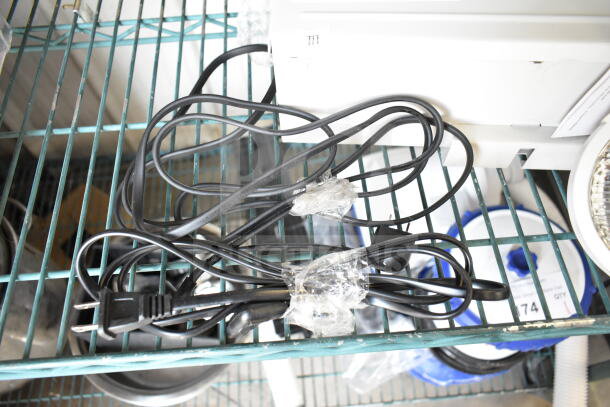 Dual Lite LMW40I-FW Emergency Light with black power cord, wrapped in plastic. Shelf-stored, appears in unused condition.