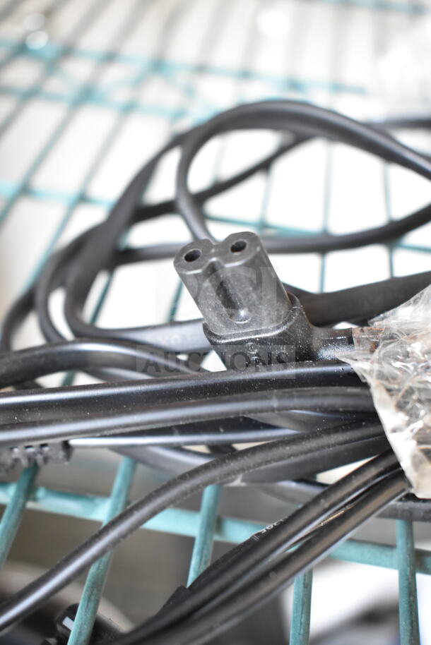 Black power cable for Dual Lite LMW40I-FW emergency light, shown coiled and loosely tied, appears in good condition.