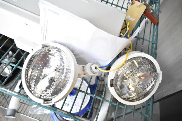 Dual Lite LMW40I-FW Emergency Light, dual lamps, good condition, visible wiring and fixture details.