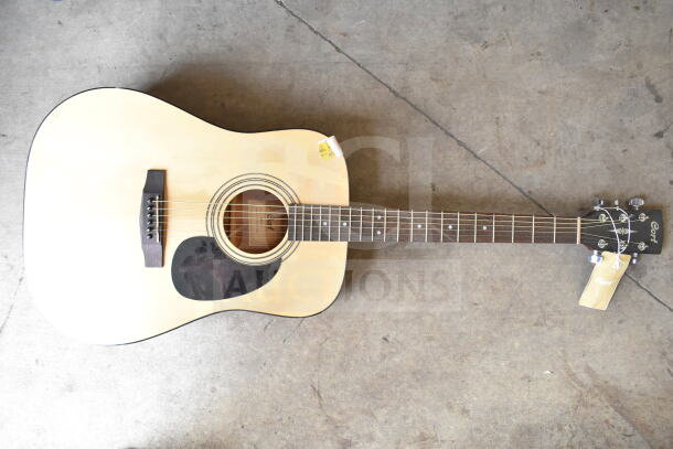Two guitars, Cort and RockJam, displayed side by side. Cort guitar features natural finish, visible brand tag. Auction set.