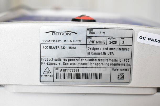 Close-up of a Ritron digital callbox model ROA-151M label, indicating VHF MURS, FCC ID: AIERIT32-151M, and location Carmel, IN, USA.