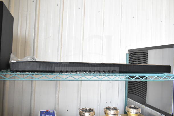 Samsung HW-T60MV Sound Bar, black, excellent condition, on metal shelf. No visible markings or labels.