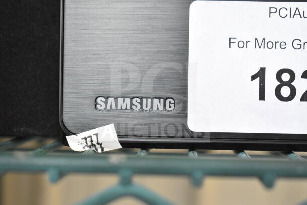 Samsung HW-T60MV Sound Bar with visible Samsung logo, in good condition, auction tag number 182 displayed.