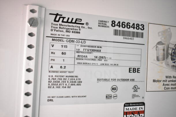 True GDM-33-LD Commercial Cooler label showing voltage, phase, and refrigerant details. Made in the USA. Serial 8466483.