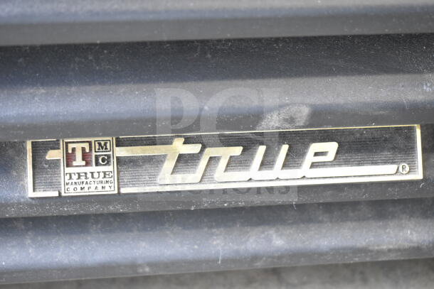True GDM-33-LD 2-Door Cooler Merchandiser, 115V, 1 Phase, True logo visible, in used condition.