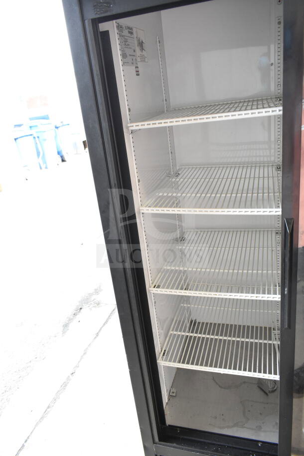 True GDM-33-LD commercial cooler, 2 doors, five shelves, 115V, 1 phase, in good condition. Interior tags visible.