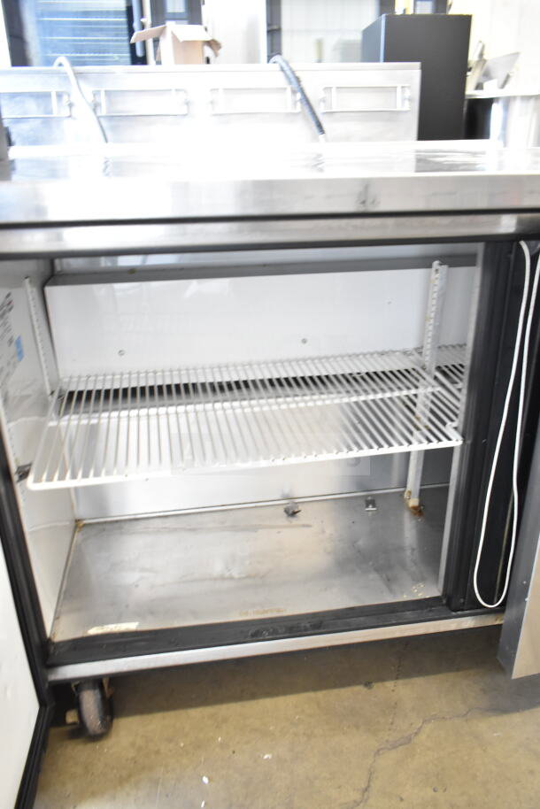 True TUC-60 commercial 2-door undercounter cooler, stainless steel, 115 volts, 1 phase, adjustable shelves, good condition.