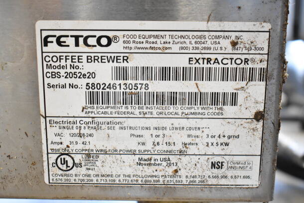 Fetco CBS-2052e20 commercial coffee machine label detailing specs: 120/208-240V, 1 Phase, serial 580246130578, made in USA.