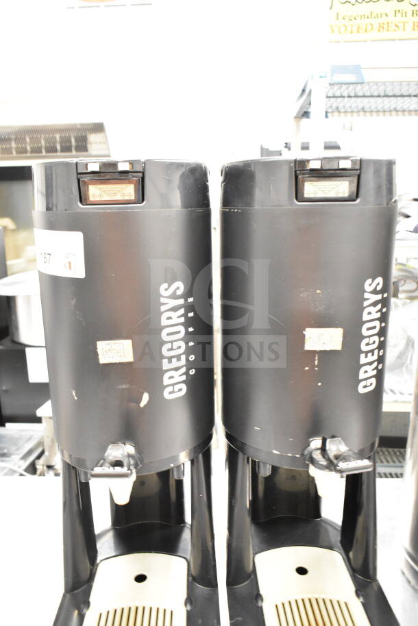 Three Gregory's Coffee satellite servers with model FC043, black finish, used condition, visible wear and labels.