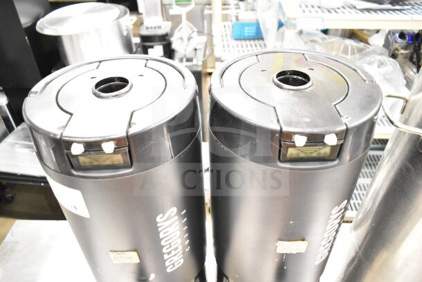 Three black satellite coffee servers, branded "Gregorys Coffee", used condition, with visible control panels.