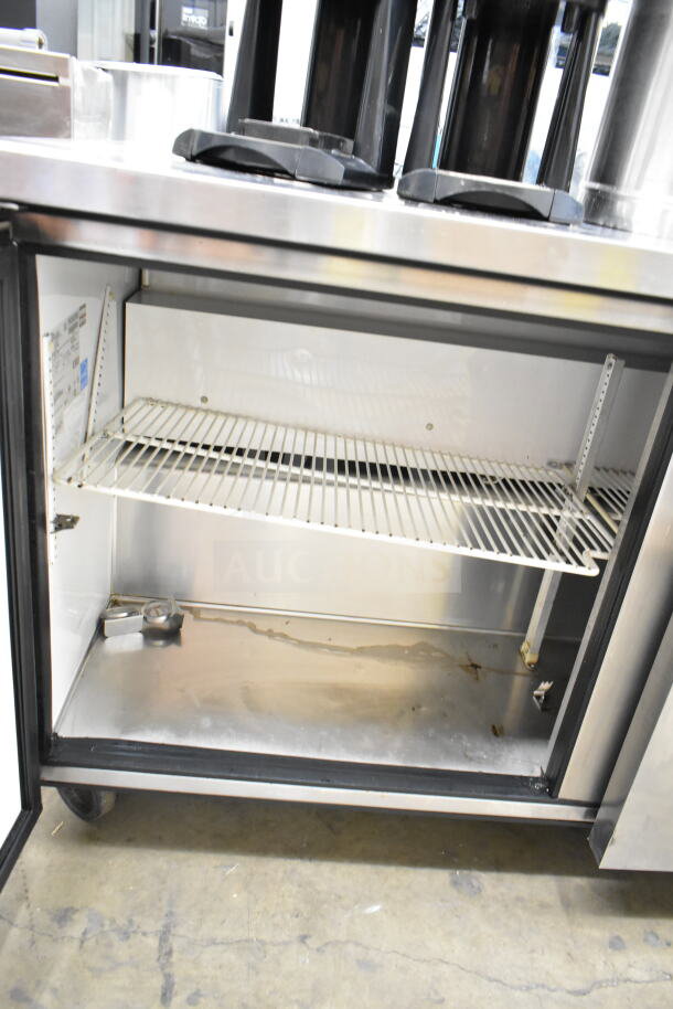 True Commercial 2 Door Undercounter Cooler, 115 Volts, 1 Phase, stainless steel interior, open for inspection.