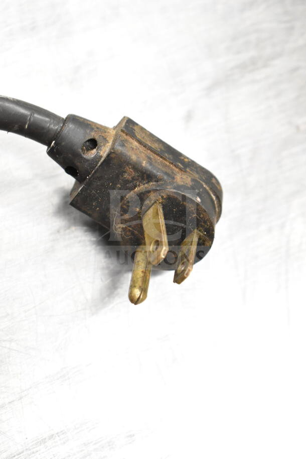 Close-up of a worn electrical plug for a True Commercial 2 Door Undercounter Cooler, 115 Volts, 1 Phase.