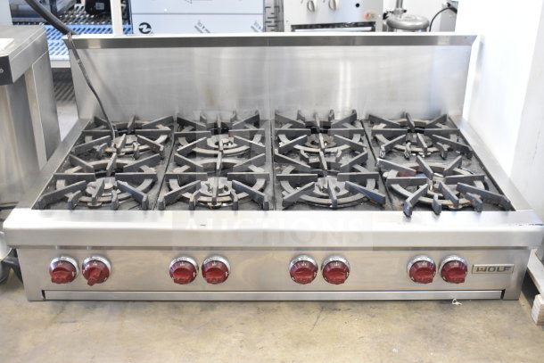 Wolf Commercial Countertop Gas 8 Burner Range, stainless steel, red knobs, used condition, branded logo visible.