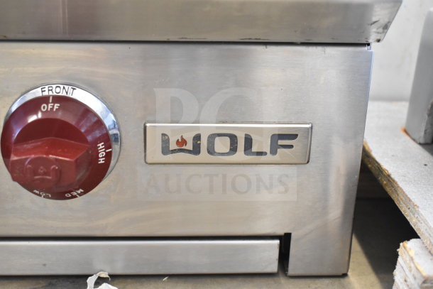 Wolf commercial countertop gas-powered 8 burner range, stainless steel, featuring front control knobs.