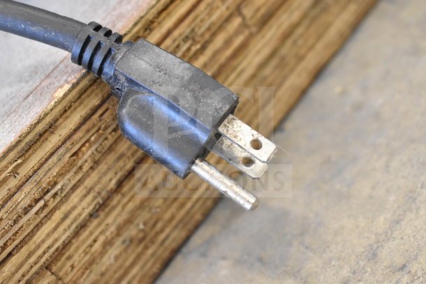 Alt text: Close-up of a black power cable for an Omcan VFM10B Commercial Dough Mixer, showing a slightly worn plug.