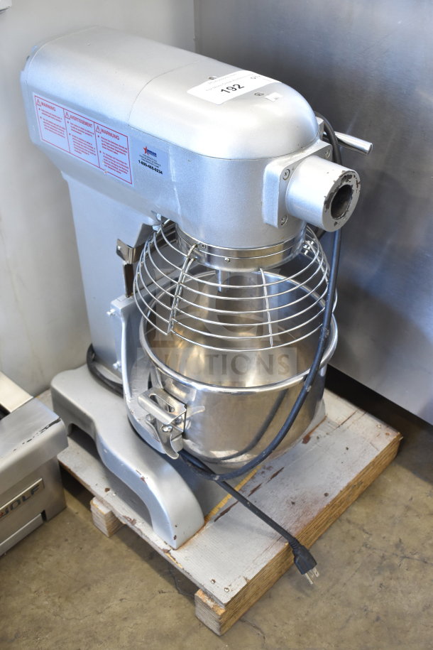 Omcan VFM10B 10 Quart Planetary Dough Mixer with mixing bowl and guard, 110V, 1 Phase; shown on a wooden pallet.