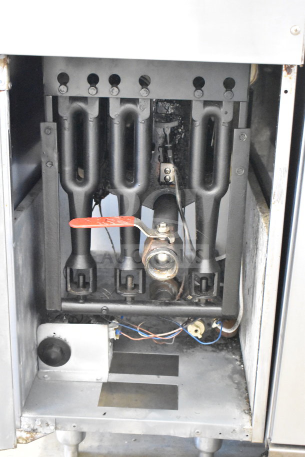 Bakers Pride commercial gas-powered deep fat fryer, floor style, visible internal components, used condition.