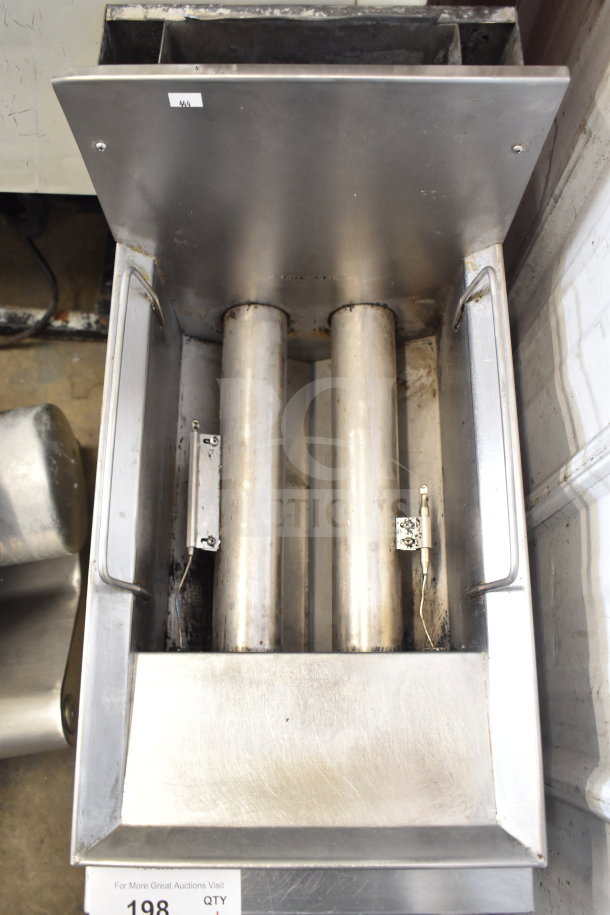 Countertop gas powered deep fat fryer, stainless steel, shows signs of use with visible heating elements, suited for commercial kitchens.