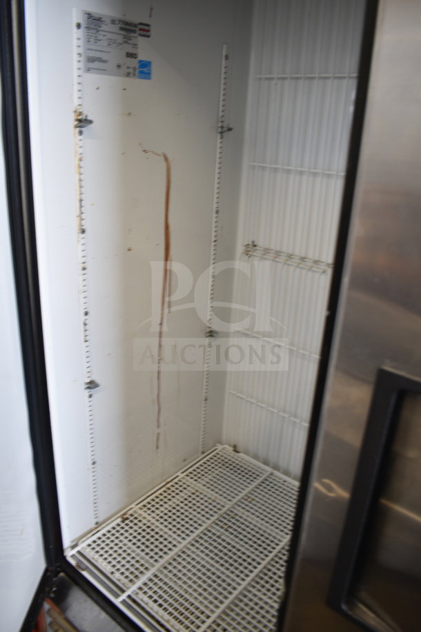 True T-49F commercial freezer, two-door, visible interior, used condition, features shelves, 115V, 1 phase, on casters.