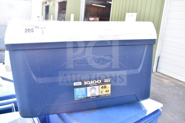 Igloo 48 Quart Portable Cooler, blue with white lid, Cool Riser Technology, good condition, label indicates capacity.