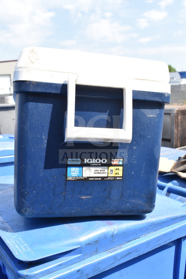 Igloo 48 Quart Portable Cooler, navy blue with white lid and handle, features Cool Riser Technology. Used condition.