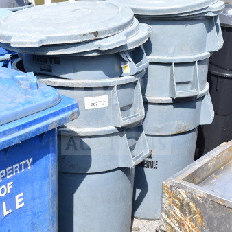 Six Rubbermaid Brute gray poly trash cans in good condition, marked as model 207, with sturdy construction.