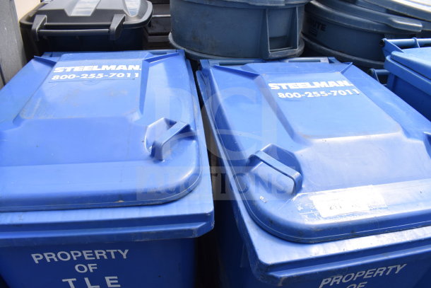 Blue poly trash cans, branded "Steelman," excellent condition, featuring contact number, durable design, set of three.