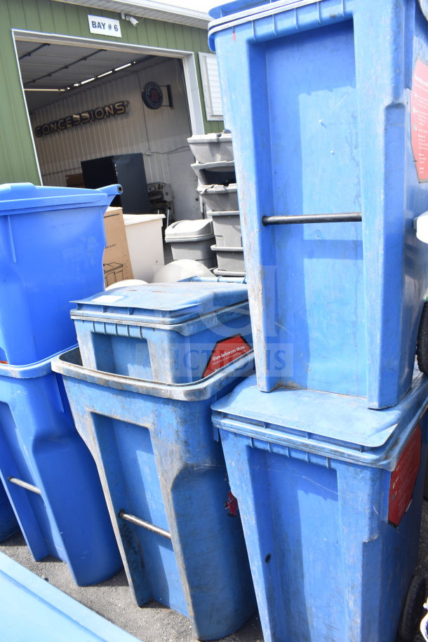 Four blue poly trash cans, weathered condition, visible "Know before you throw" labels. Auction item multiplier applies.