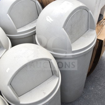 Three tan Rubbermaid poly trash cans with dome lids, slight wear, labels on lids. Auction: 3 times your bid.