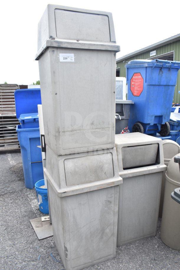 Three tan poly trash cans, stackable, used condition, visible label "220", durable and suitable for outdoor use.