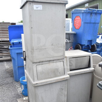 Three tan poly trash cans, stackable, used condition, visible label "220", durable and suitable for outdoor use.