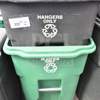 Two poly trash cans labeled "Hangers Only" and "Plastics Only," black and green, with recycling symbols. Slightly used condition.