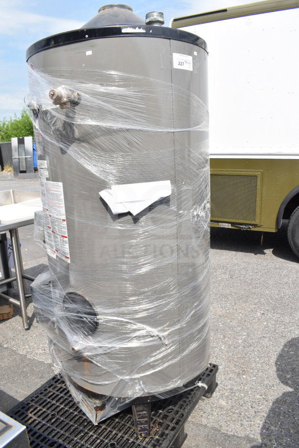 Rheem Universal G100-200, 100-gallon commercial natural gas water heater, wrapped in plastic, labels and parts visible.