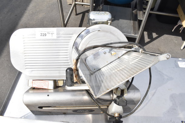 Globe 300 commercial countertop meat slicer with blade sharpener, 115 volts, 1 phase, used condition, visible markings.