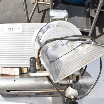 Globe 300 commercial countertop meat slicer with blade sharpener, 115 volts, 1 phase, used condition, visible markings.