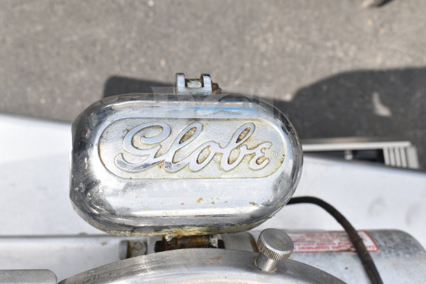 Globe 300 Commercial Meat Slicer with Blade Sharpener, 115 Volts, 1 Phase, showcases Globe logo. Used condition.