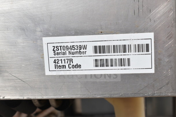Commercial stainless steel table with ice bin, visible serial number ZST094539W, and item code 42117R label.