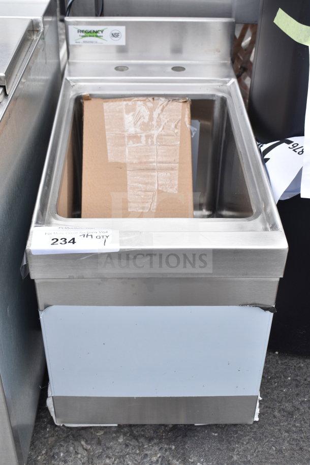 "Brand new Regency 600UHS2112 underbar hand sink with minor dents, 21x12 inches, with visible NSF label, stainless steel."