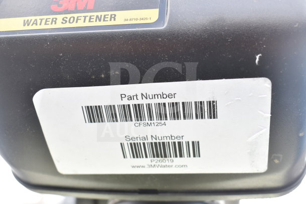 3M Water Softener Tank with labels showing Part Number CFSM1254 and Serial Number P26019. Marks of use visible.