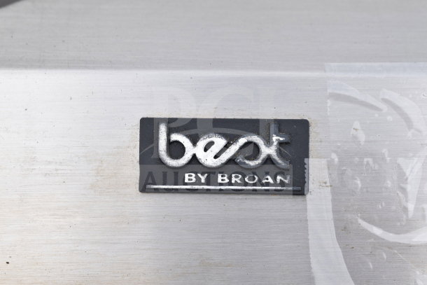 "Best by Broan" kitchen hood label in stainless steel. Condition shows minor wear.