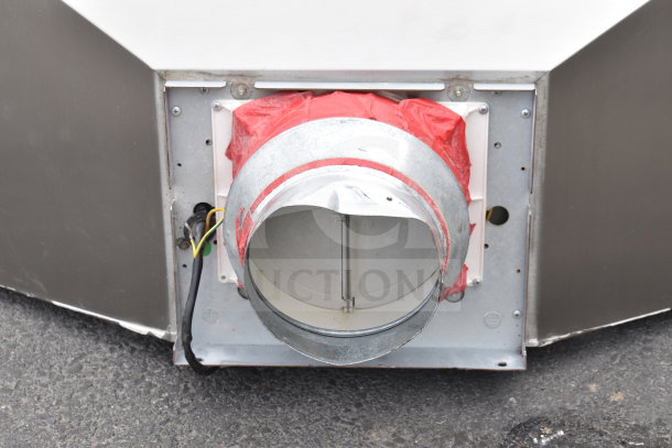 Stainless steel Best by Broan hood, featuring a duct connector with red sealing tape and exposed wiring; suitable for industrial use.