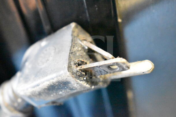 Close-up of the plug of a 2018 Leader ESLS48 S/C Commercial 2 Door Reach In Cooler Merchandiser.