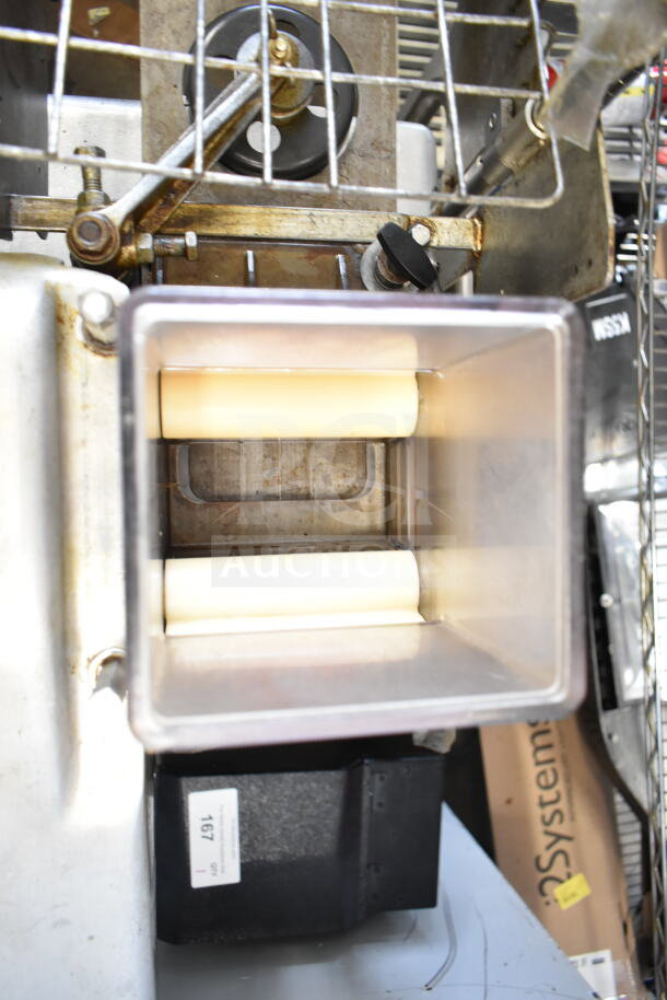 Hollymatic commercial patty former machine on cart, 115 volts, 1 phase, visible metal components, condition appears used.