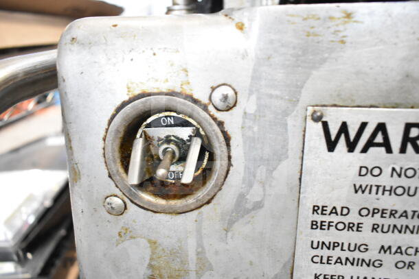 Hollymatic patty former machine on cart, showing on/off switch, used condition, with visible warning label. 115 volts, 1 phase.