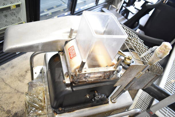 Hollymatic commercial countertop patty former machine on cart, 115 volts, 1 phase, in used condition, with visible wear.
