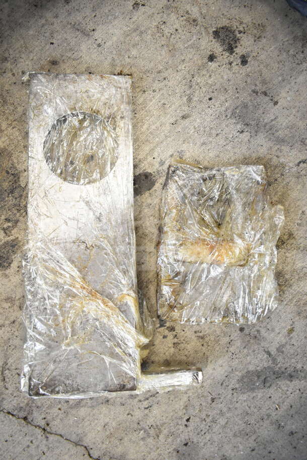 Hollymatic Commercial Countertop Patty Former Machine, wrapped in plastic, on concrete. 115 Volts, 1 Phase, used condition.